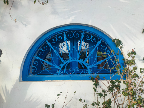 Sidi Bou Said, a famous village with traditional white and blue Tunisian architecture and wrought iron window   Tunisia.