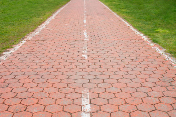 Orange rectangles rectangular cobblestone background in city square against sunlight