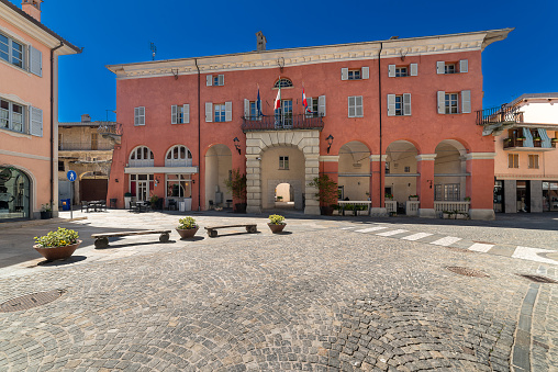 Chiusa di Peso, Cuneo, Italy - April 19, 2024: The town hall seen from via Roma on clear blue sky