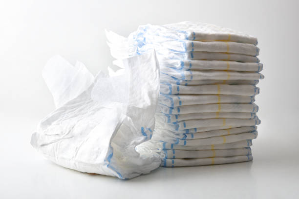 istock Pile of diapers on white table isolated on bench background 2149393015