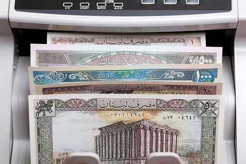 Old Yemeni money - rial in a counting machine