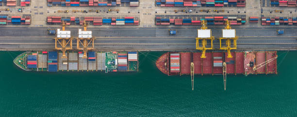 istock Industrial import-export port prepare to load containers. Aerial top view container ship in export and import global business and logistic. Global transportation and logistic business. 2149394146