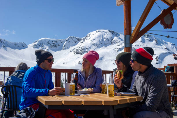 istock Friends ski down slope at ski resort 2149394361