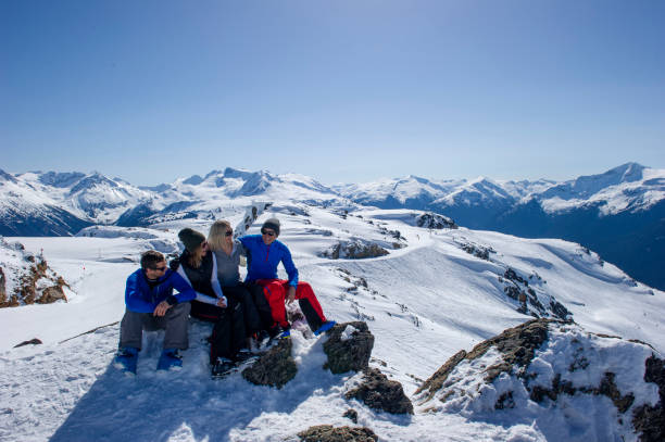 istock Friends ski down slope at ski resort 2149394374