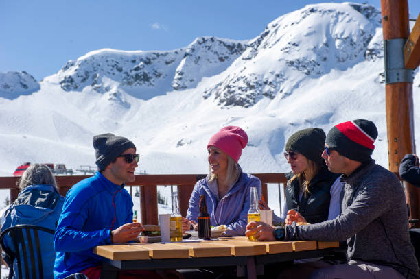 istock Friends ski down slope at ski resort 2149394395