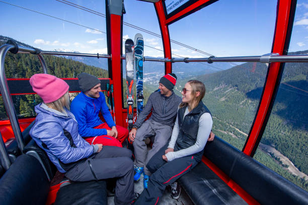 istock Friends ski down slope at ski resort 2149394427