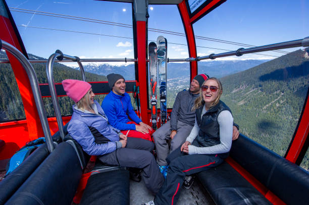 istock Friends ski down slope at ski resort 2149394433