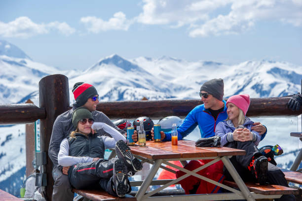 istock Friends ski down slope at ski resort 2149394459