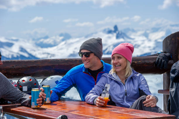istock Friends ski down slope at ski resort 2149394495