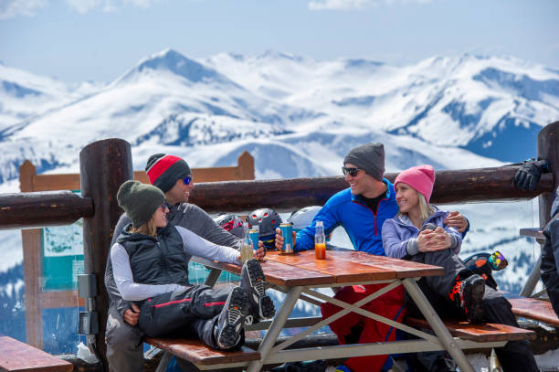 istock Friends ski down slope at ski resort 2149394497