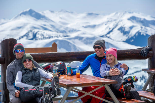 istock Friends ski down slope at ski resort 2149394506