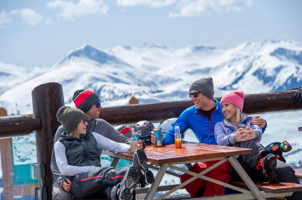 istock Friends ski down slope at ski resort 2149394532