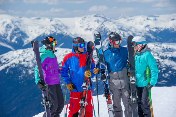 istock Friends ski down slope at ski resort 2149394553