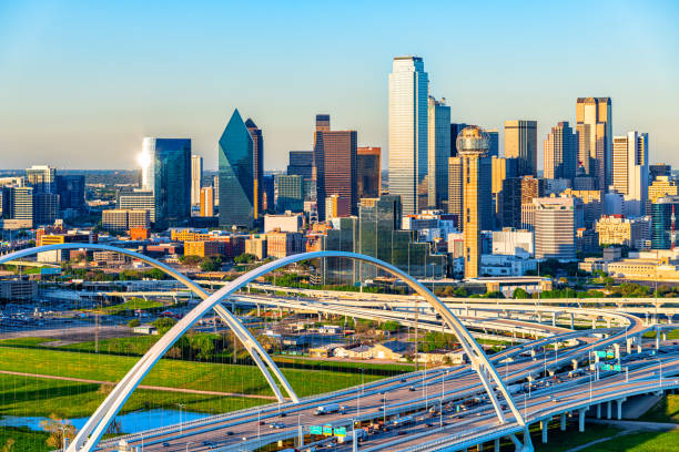Dallas Skyline Aerial Beautiful downtown Dallas, Texas shot via helicopter from an altitude of about 500 feet at dusk on an early spring evening. aircraft point of view stock pictures, royalty-free photos & images