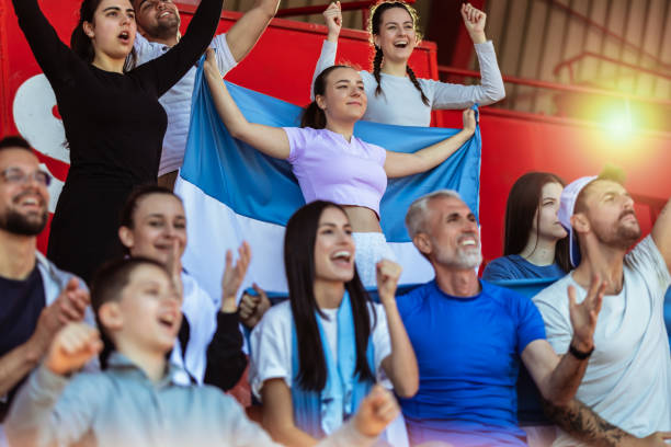 istock Sport fans cheering at the game on stadium. . 2149397777