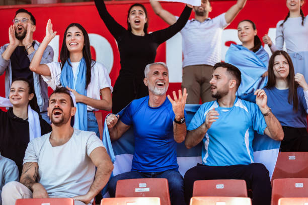 istock Sport fans cheering at the game on stadium. . 2149397794