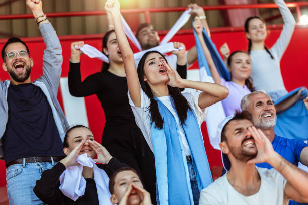 istock Sport fans cheering at the game on stadium. . 2149397797