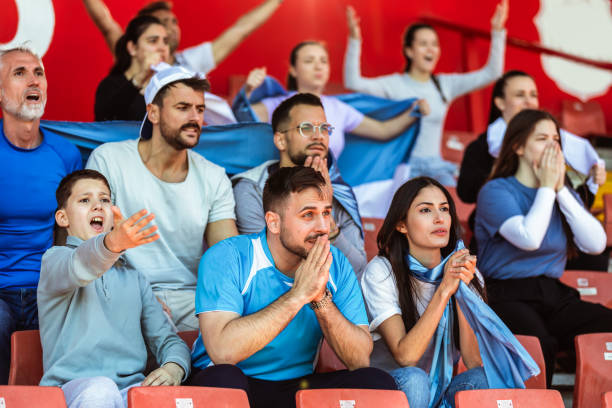 istock Sport fans cheering at the game on stadium. . 2149397826