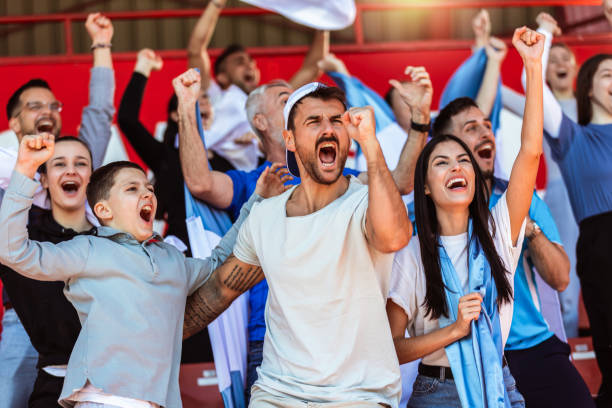istock Sport fans cheering at the game on stadium. . 2149397830