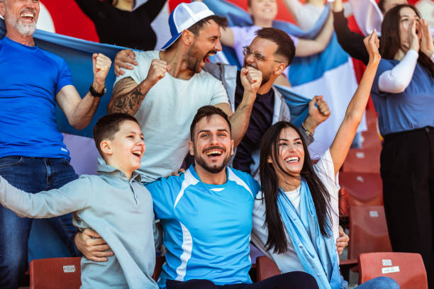 istock Sport fans cheering at the game on stadium. . 2149397831