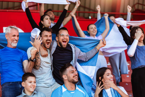 istock Sport fans cheering at the game on stadium. . 2149397847