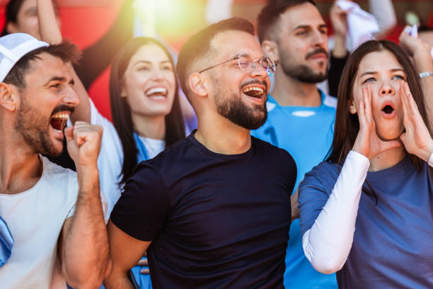 istock Sport fans cheering at the game on stadium. . 2149397867