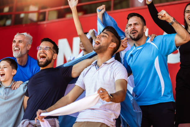 istock Sport fans cheering at the game on stadium. . 2149397938