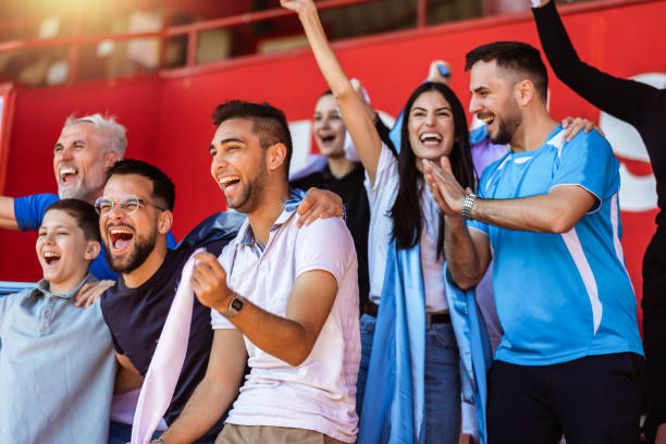 istock Sport fans cheering at the game on stadium. . 2149397943