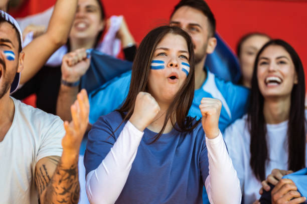 istock Sport fans cheering at the game on stadium. . 2149397968
