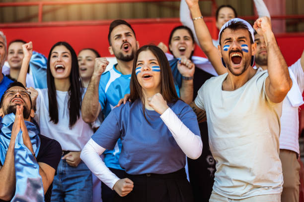 istock Sport fans cheering at the game on stadium. . 2149397980