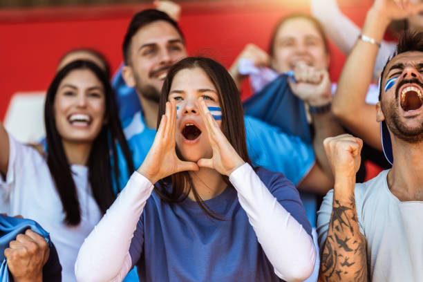 istock Sport fans cheering at the game on stadium. . 2149397983