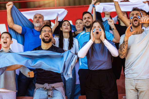istock Sport fans cheering at the game on stadium. . 2149397984