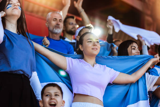 istock Sport fans cheering at the game on stadium. 2149398676