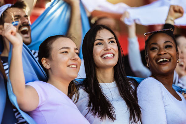 istock Sport fans cheering at the game on stadium. 2149398716
