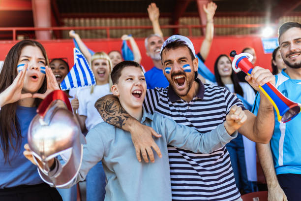 istock Fans cheering at the game on stadium. 2149398789