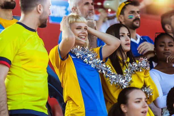 istock Sport fans cheering at the game on stadium. 2149398874
