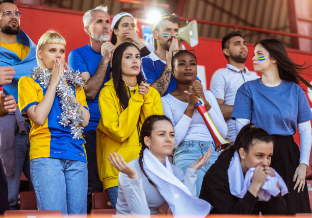 istock Sport fans cheering at the game on stadium. 2149398875