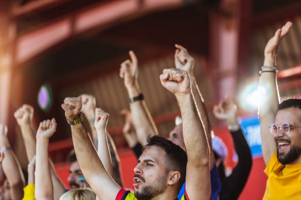 istock Sport fans cheering at the game on stadium. 2149398925