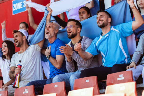 istock Sport fans cheering at the game on stadium. . 2149398956