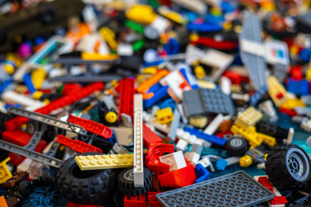 istock Background from the designer. Multi-colored construction kit parts lie in a large pile. Design parts for various toys. Background designer. 2149401410