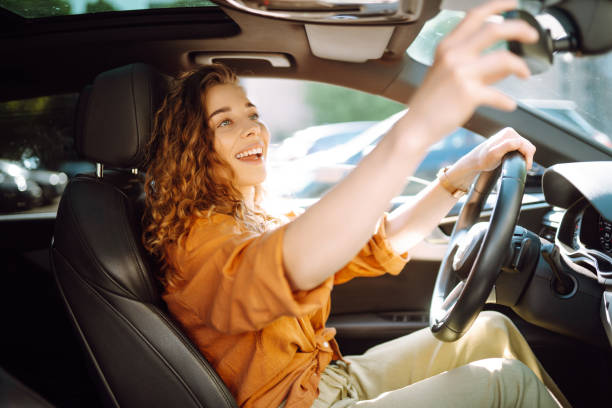 istock Young woman driving a car. 2149402511