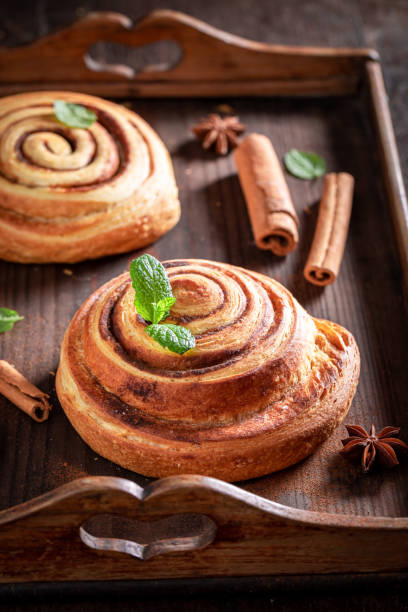 istock Fresh and sweet cinnamon rolls served with milk. 2149403443