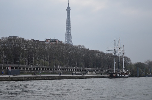 Paris, France 03.24.2017: The boat La Boudeuse moored on the Seine River embankment - the Gros-Caillou harbor in Paris