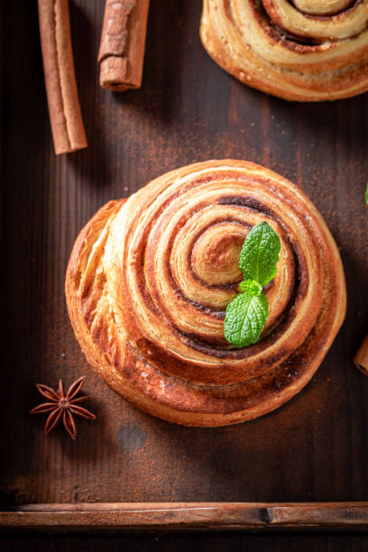 istock Hot and tasty cinnamon rolls with cinnamon and sugar. 2149403722