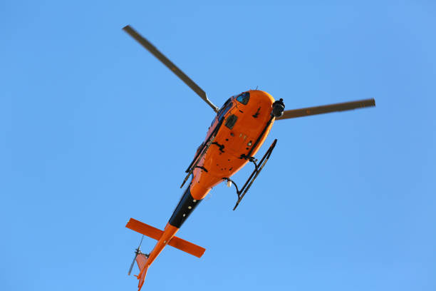 istock yelow helicopter flying in the sky 2149403750
