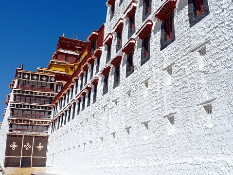 Walls and windows of the Potala Palace, seen from the staircase. Lhasa, Tibet Autonomous Region, China.