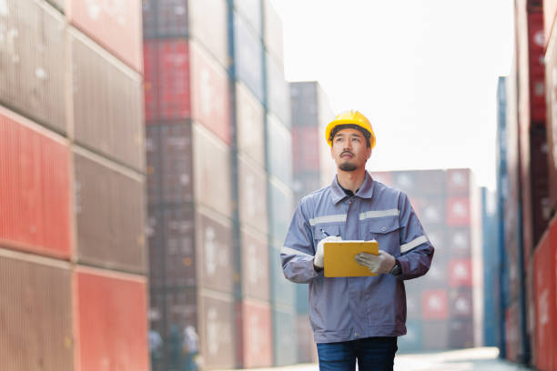 istock Custom officer inspects a cargo container at shipping yard. 2149408684