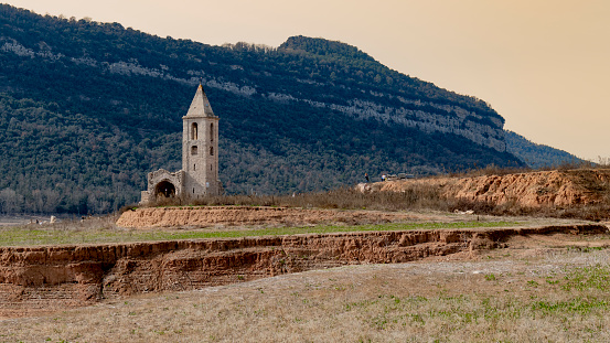 The impact of the ongoing drought on the Sau Reservoir in Catalunya.
The bell tower of the old, abandoned village of Sant Romà, located in central Catalonia's Sau reservoir. Spain
