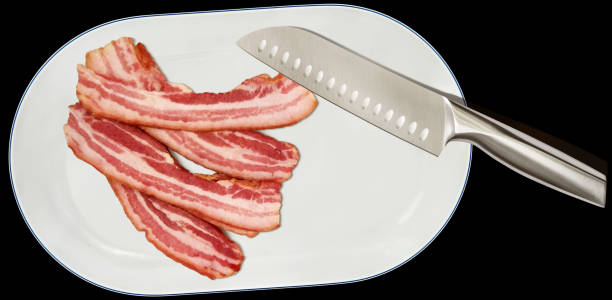 Bunch Of Boiled Pork Belly Bacon Rashers And Santoku Kitchen Knife On Oval White Porcelain Tray Isolated On Black Background High Resolution Stock Photo