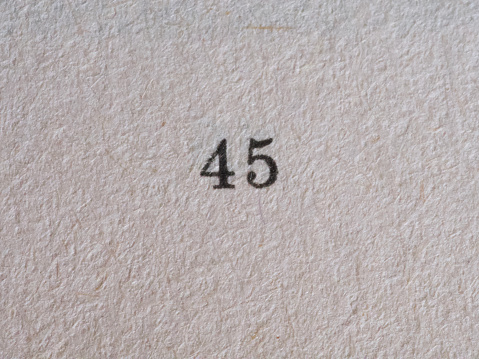 The number 45 printed on a piece of paper. Paper texture.